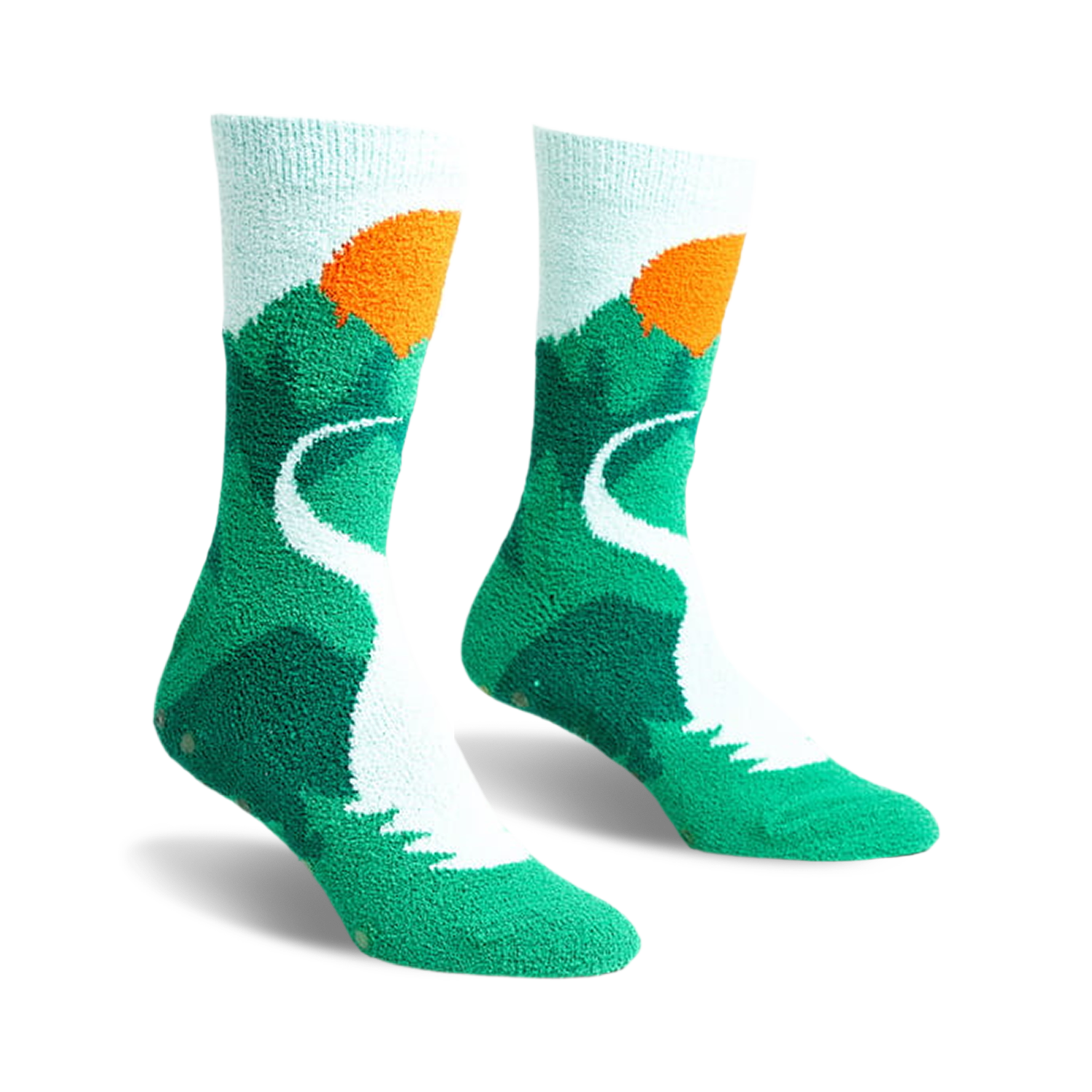 Pair of teal and light blue fuzzy slipper socks with a mountain and sunset design. Non-slip grips on the soles.