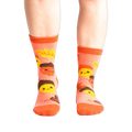 Lifestyle shot: Person wearing coral Acorn-ey socks. Shows how the socks fit.