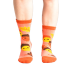Lifestyle shot: Person wearing coral Acorn-ey socks. Shows how the socks fit.