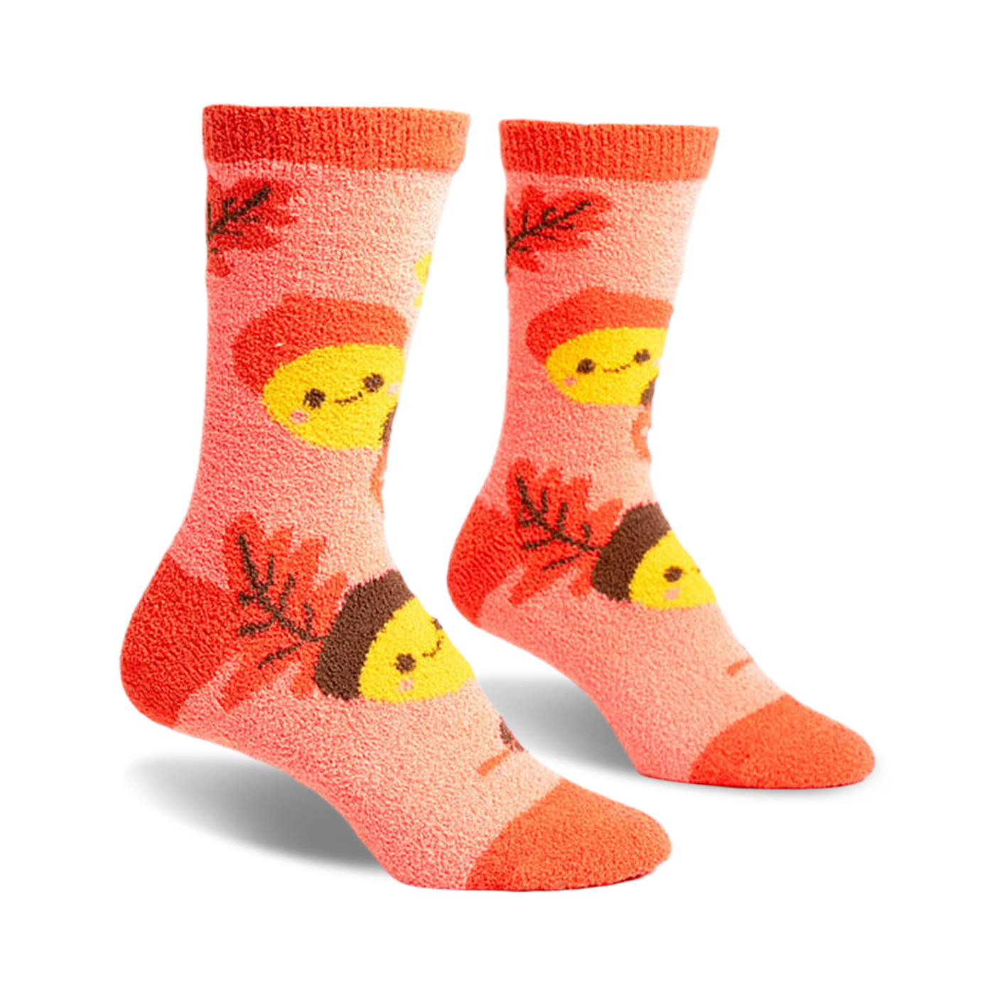 Pair of coral fuzzy socks with an acorn and leaf pattern.  Acorns have smiling faces.  Brown and yellow details.