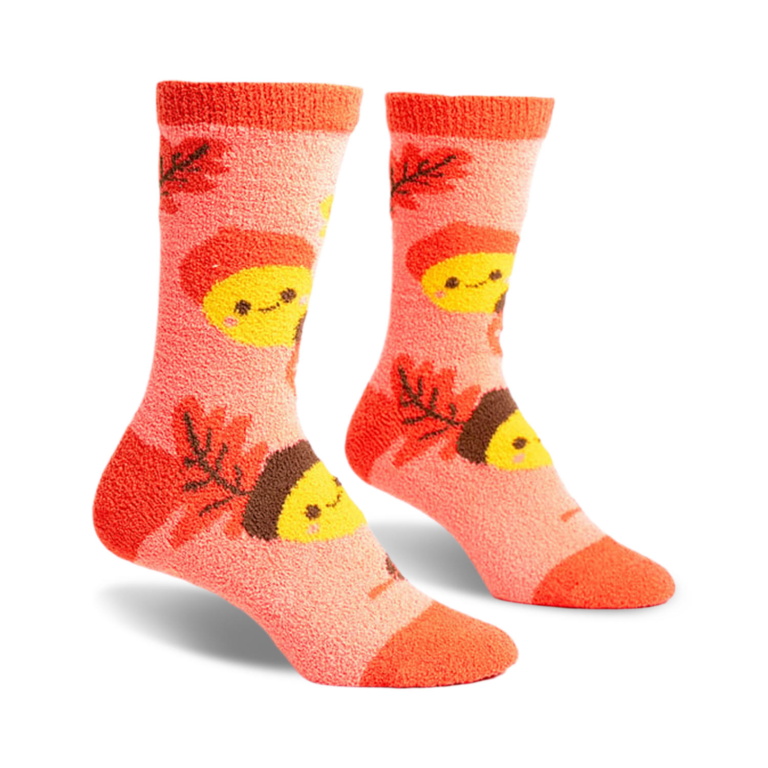 Pair of coral fuzzy socks with an acorn and leaf pattern.  Acorns have smiling faces.  Brown and yellow details.