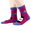 Another view of the 'You Are Really Grape' socks on a person's feet, from the side.