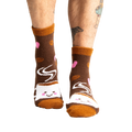 Lifestyle photo showing the socks on a person's feet. 