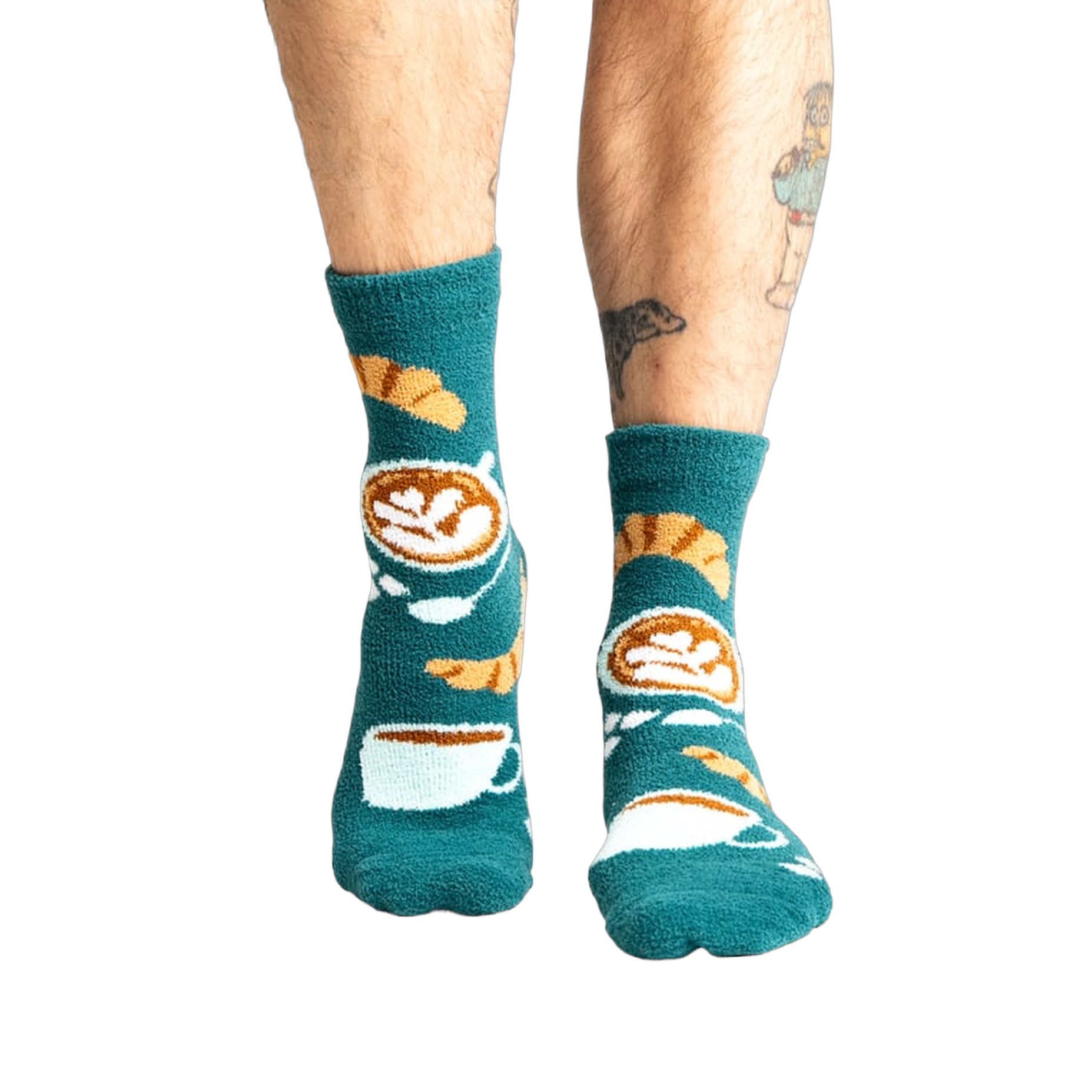 Lifestyle shot of model wearing teal blue coffee and croissant slipper socks.