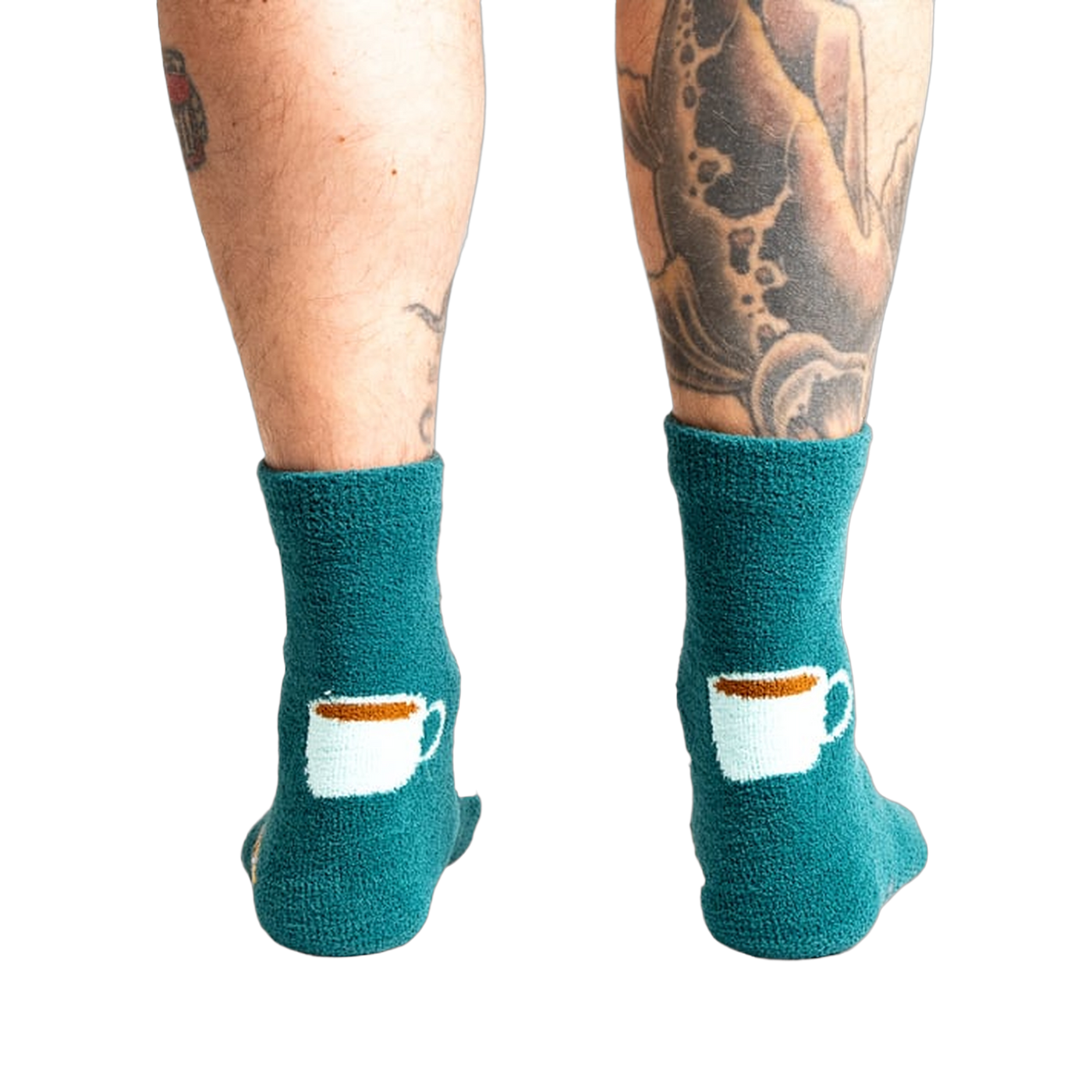 Close-up shot of the back of the teal blue coffee and croissant slipper socks.
