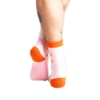Close-up shot of the back of the pink gingerbread slipper socks.