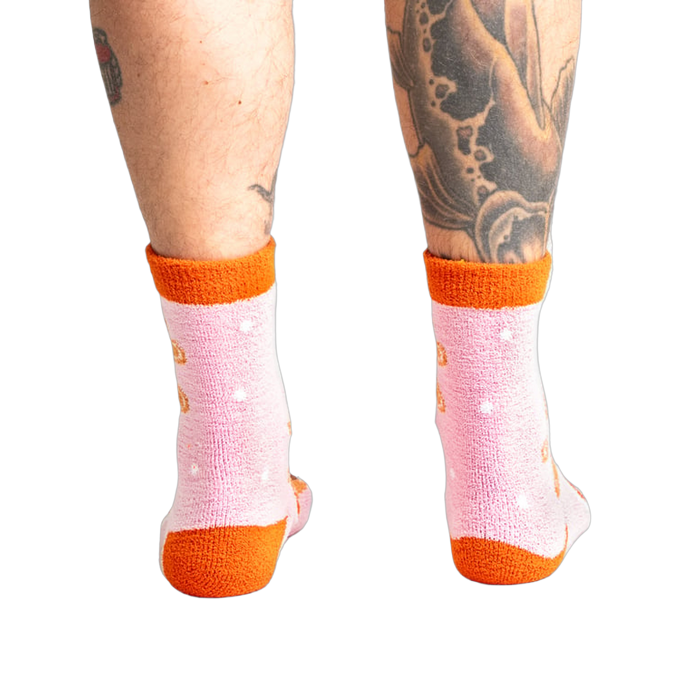 Back view of model wearing the pink and orange gingerbread socks.