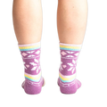 Rear view of socks on legs showing off the pastel stripes and snowflake design.