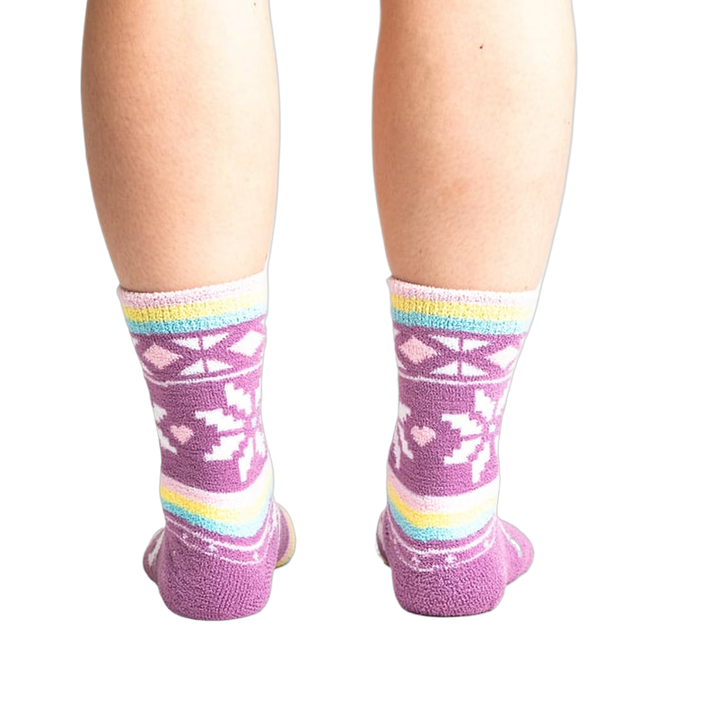 Rear view of socks on legs showing off the pastel stripes and snowflake design.