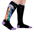 Person wearing a pair of 'The Truth Is Out There' knee-high socks. Shows how they look on.