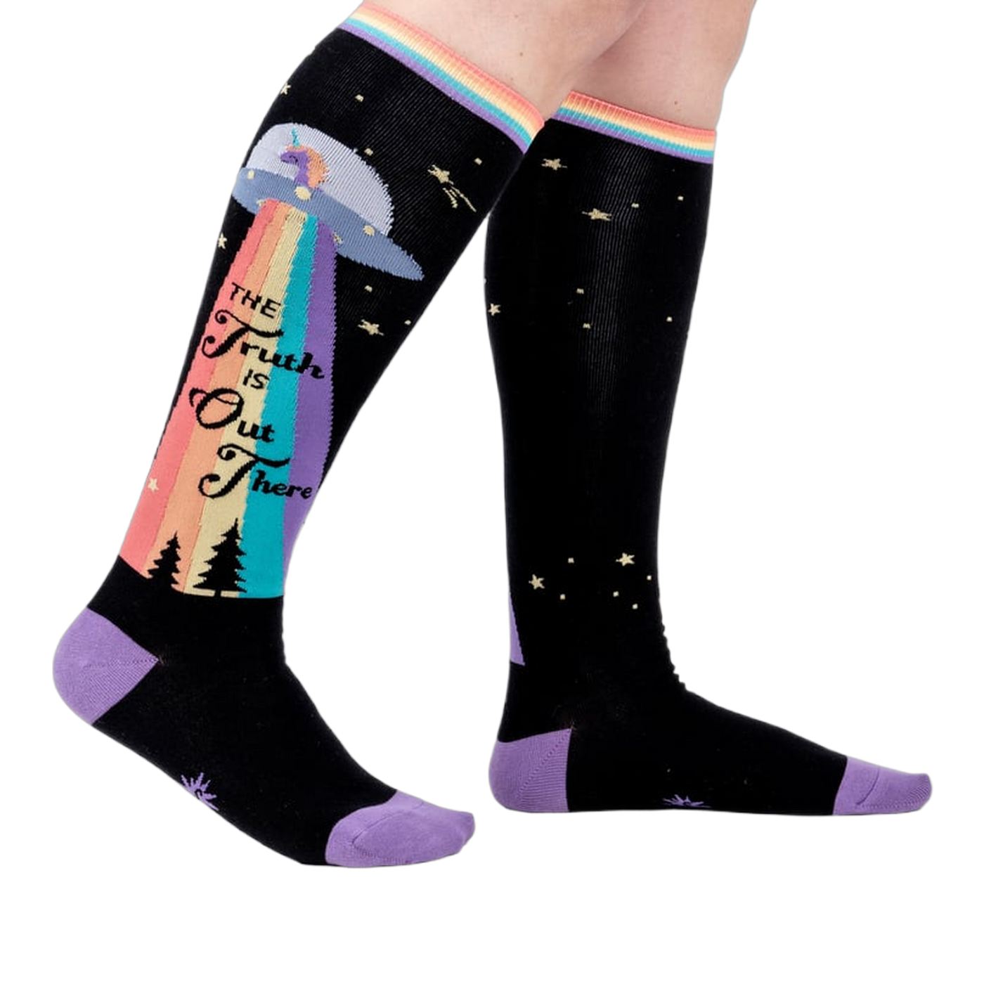 Person wearing a pair of 'The Truth Is Out There' knee-high socks. Shows how they look on.