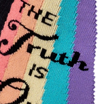 Close-up detail of the 'The Truth Is Out There' text and rainbow graphic on the socks.