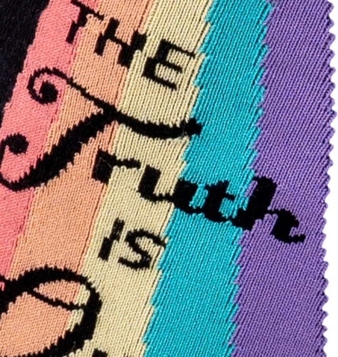 Close-up detail of the 'The Truth Is Out There' text and rainbow graphic on the socks.