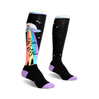 Pair of black knee-high socks with a colorful rainbow, UFO, and 'The Truth Is Out There' graphic. Purple accents at the cuff. 
