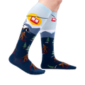 Lifestyle shot: Model wearing the Bigfoot skiing socks, showing the full design.