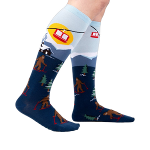 Lifestyle shot: Model wearing the Bigfoot skiing socks, showing the full design.