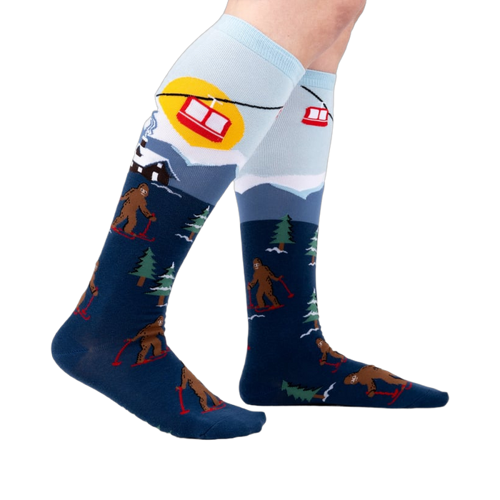 Lifestyle shot: Model wearing the Bigfoot skiing socks, showing the full design.