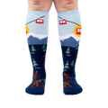 Front view of the socks on a model, highlighting the colorful design and fit.