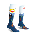 Pair of blue and light blue knee-high socks. Design features Bigfoot skiing, a snowy mountain scene, and a ski lift.