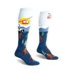 Pair of blue and light blue knee-high socks. Design features Bigfoot skiing, a snowy mountain scene, and a ski lift.