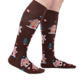 Lifestyle shot showing the socks on a person's legs, showcasing their length and fit.