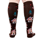 Back view of the socks on a person's legs showing the back of the design.