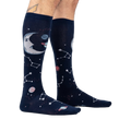Moonshadow socks on a model's legs, showcasing the glow-in-the-dark feature.