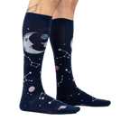 Moonshadow socks on a model's legs, showcasing the glow-in-the-dark feature.