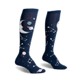 Pair of navy blue knee-high socks with a crescent moon, planets, and constellations design. Glows in the dark!