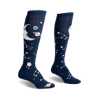 Pair of navy blue knee-high socks with a crescent moon, planets, and constellations design. Glows in the dark!