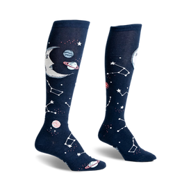 front view of a pair of knee-high socks with a moon, stars, and planets printed on them.