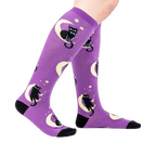 Lifestyle shot showing the socks on a person's legs, showcasing the fit and design.