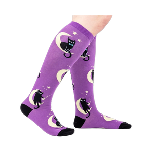 Lifestyle shot showing the socks on a person's legs, showcasing the fit and design.