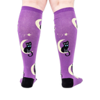 Back view of the socks on a person's legs showcasing the complete design.