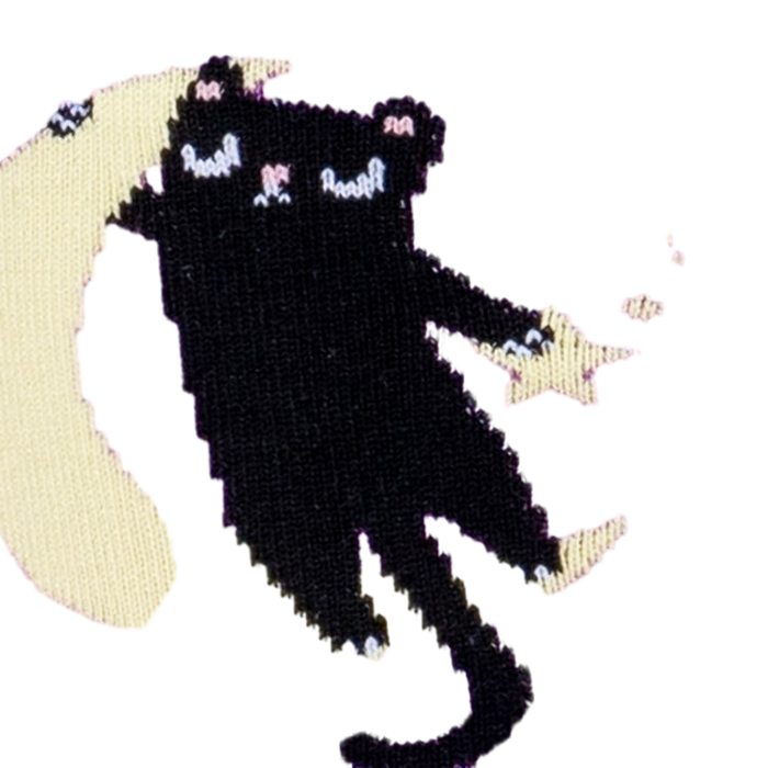Close-up detail shot of the sock's design, focusing on a cat sitting on a moon.