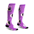 Pair of purple knee-high socks with black cats wearing bow ties sitting on crescent moons and stars.