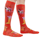 Lifestyle shot showing the 'Herding Cats' socks on a person's legs.