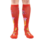Front view of the 'Herding Cats' socks on a person's legs.