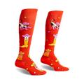 Pair of orange knee-high socks with a fun design of cats wearing cowboy hats and boots.  Stars and cacti are also featured.
