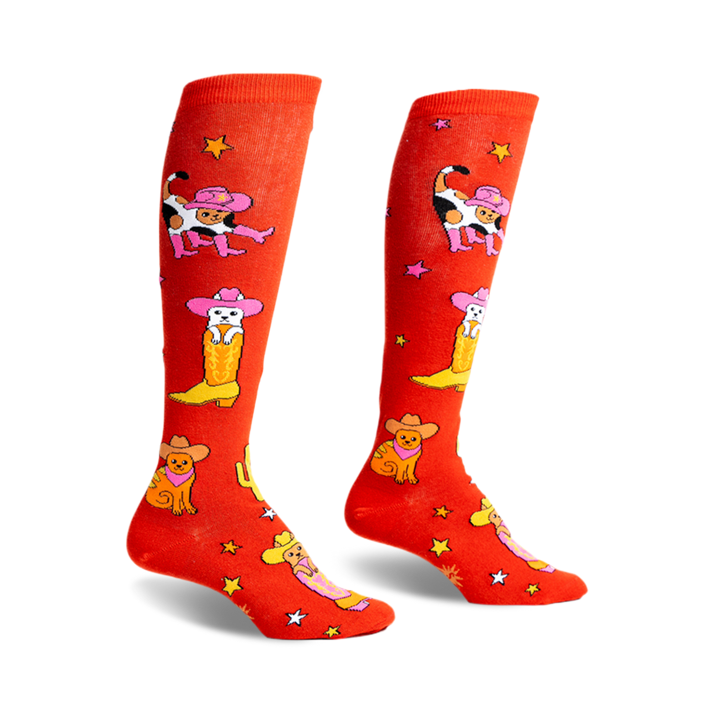 Pair of orange knee-high socks with a fun design of cats wearing cowboy hats and boots.  Stars and cacti are also featured.
