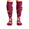 Lifestyle shot of model wearing Autumn Harvest knee-high socks.
