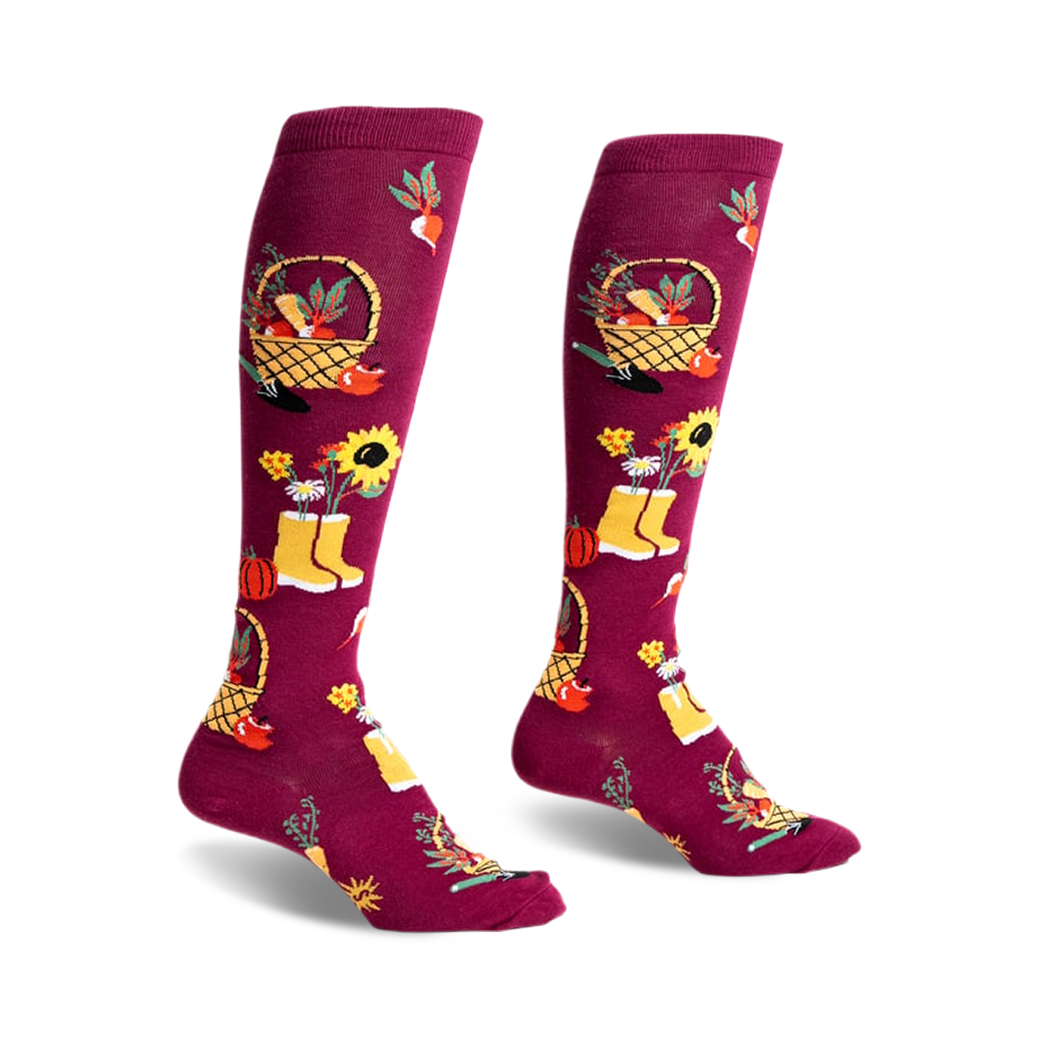 Pair of burgundy knee-high socks with autumn harvest design: pumpkins, sunflowers, baskets, and yellow boots.