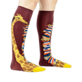 Knee-high socks on a model's legs, showcasing the giraffe and book design.