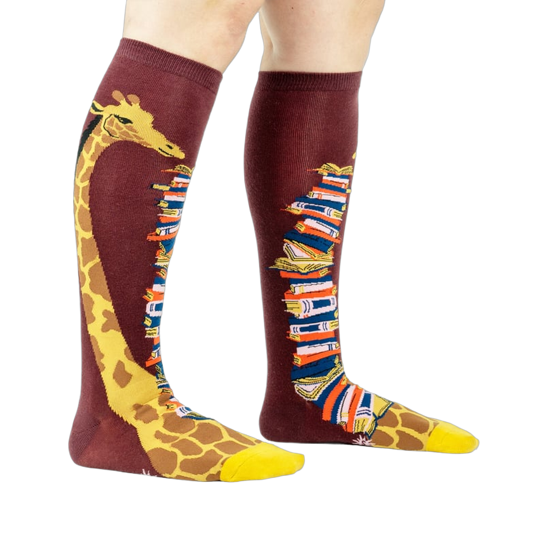 Knee-high socks on a model's legs, showcasing the giraffe and book design.
