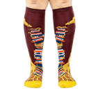 Front view of the socks, clearly showing the details of the giraffe and books.