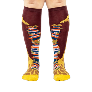 Front view of the socks, clearly showing the details of the giraffe and books.