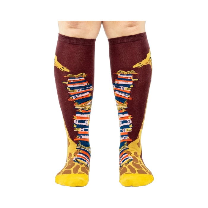 Front view of the socks, clearly showing the details of the giraffe and books.