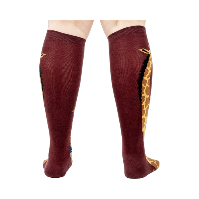 Back view of the socks, highlighting the giraffe design on both socks.