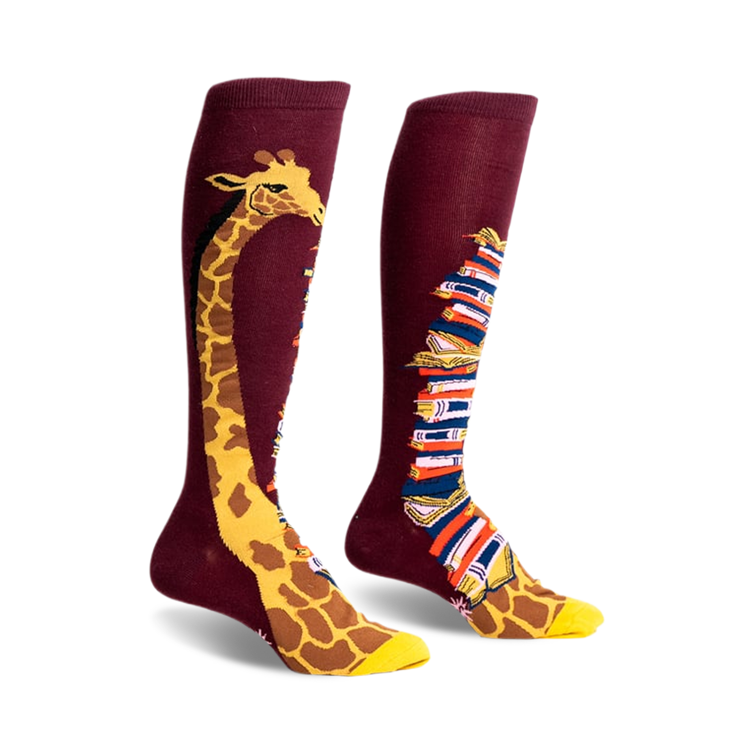 Pair of burgundy knee-high socks. One sock has a giraffe's neck & head; the other, a stack of colorful books.