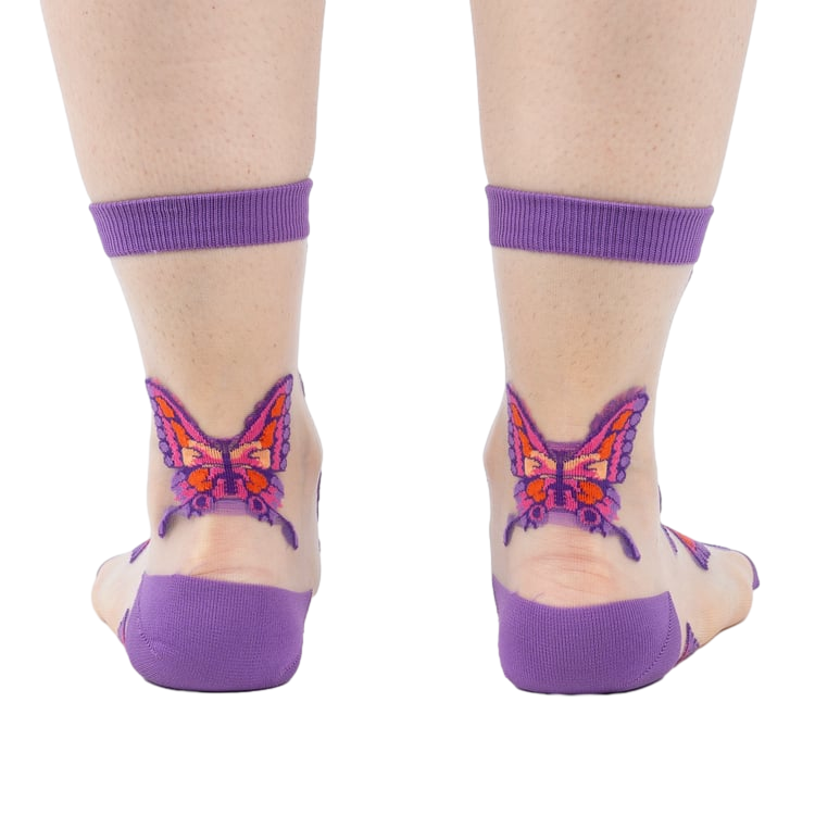 Close-up detail shot showcasing the butterfly design on the sheer sock fabric.